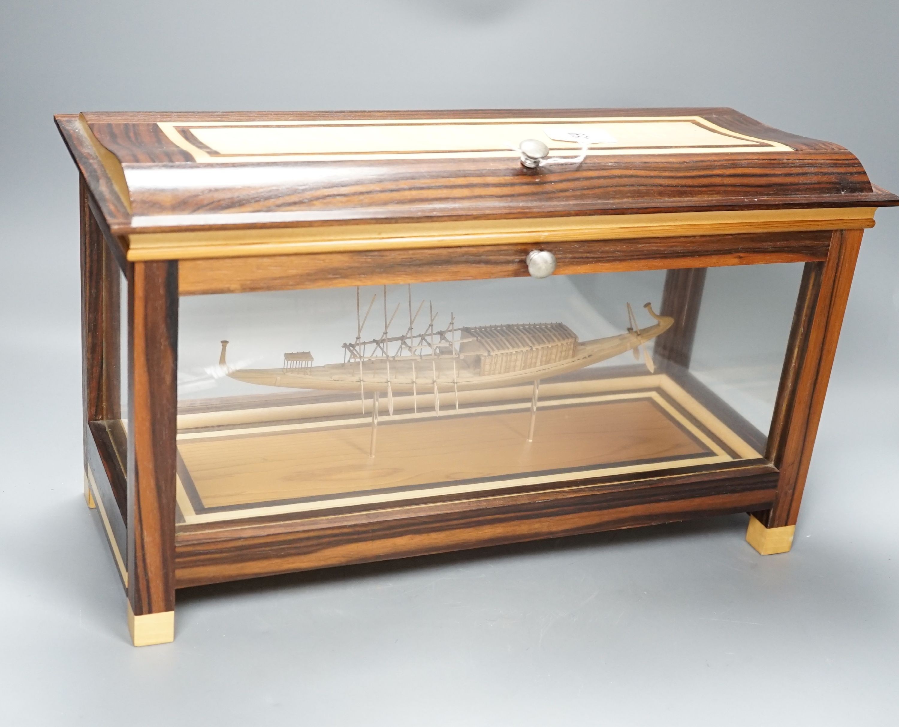 A calamander cased model of an Ancient Egyptian barge, width 42 cms
